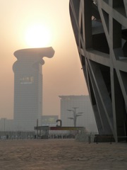 Sun lit Olympic Torch from the Birds Nest